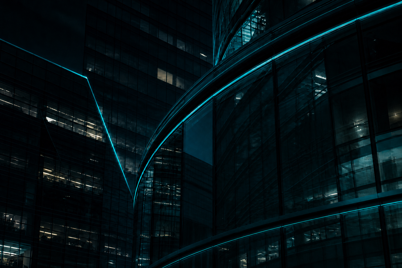 Dark glass buildings with cyan edge lighting